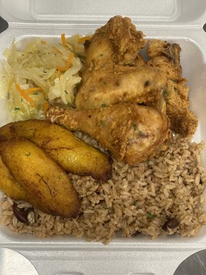 Fried chicken, rice and peas and steamed cabbage