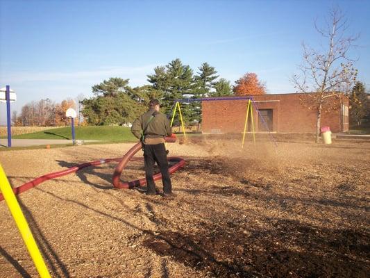 Playground mulch being installed with our blower truck