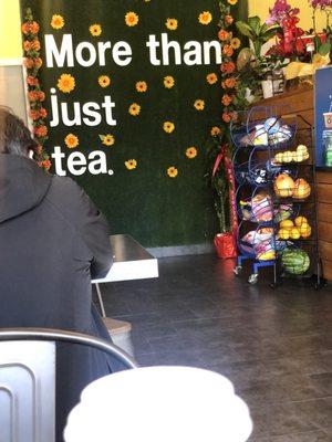 Tea mural in front of 3 tables.