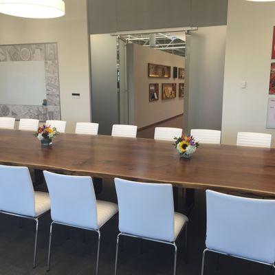 Walnut slab in corporate boardroom.