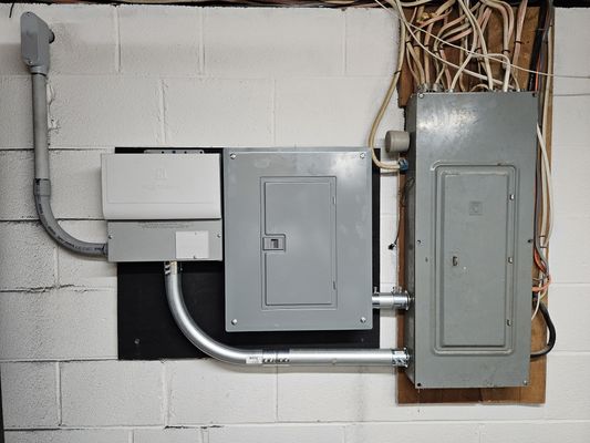 A new subpanel and transfer switch for a generator hookup installed for a customer