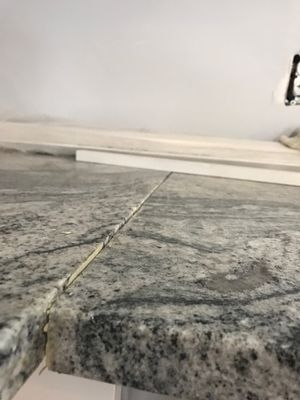 Faulty seam job... granite slabs were not leveled.