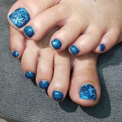 Classic pedicure with marble swirl and glitter