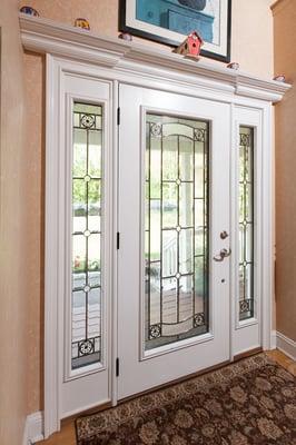 Front door with full crown moulding detail.