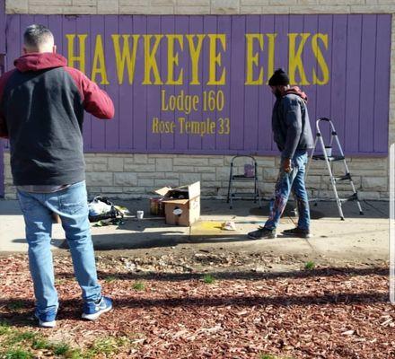 Artists redoing the sign