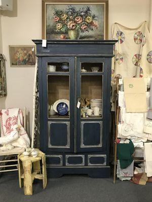 Antique French armoire with original blue paint and chicken wire.