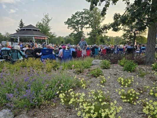 People gathering in Crosslake Town Square for free family events.