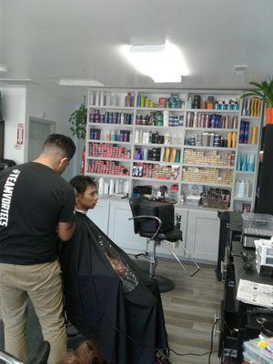 My sweetheart getting his hair cut.