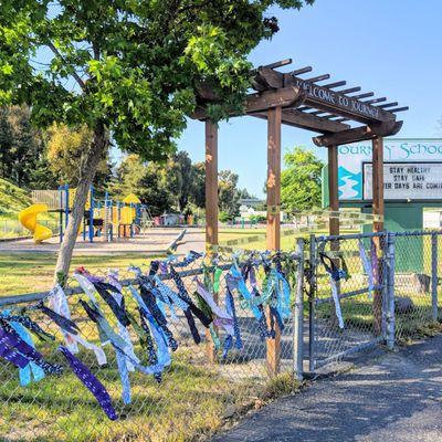 Front gate, front playground and grass area.