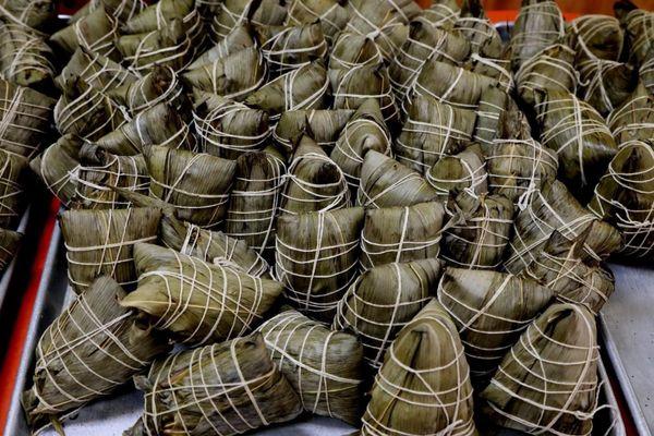 So many handmade Zongzi (Chinese tamale) freshly steamed for over 5 hours.