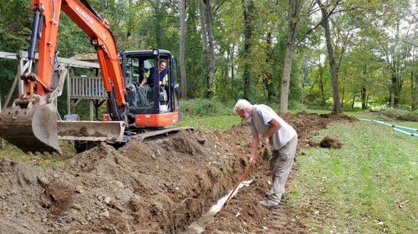 Kyle and Barry digging the trench and working their magic.