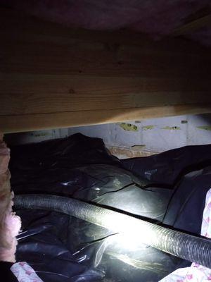 improperly installed vapor barrier with exposed radon piping