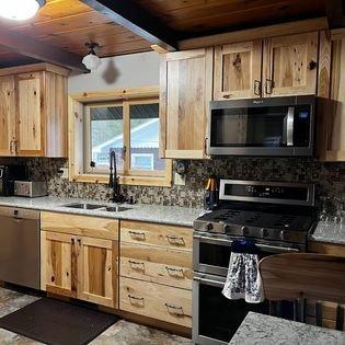 Entire kitchen from floor, cabinets, countertops and backsplash