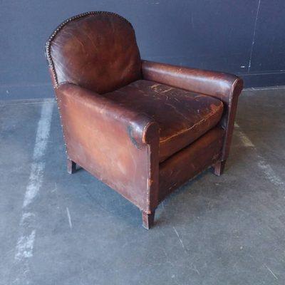 Distressed leather club chair.