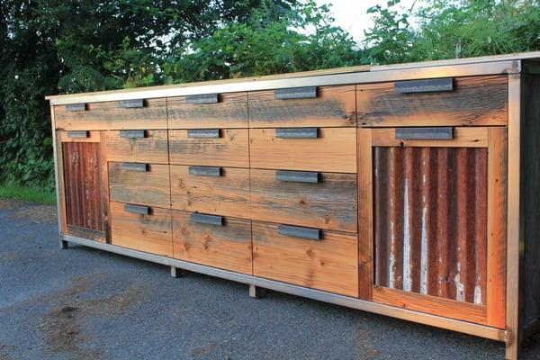 Workbench; steel frame faced w/ salvaged fir and tin from deconstructed barn. Custom pulls.