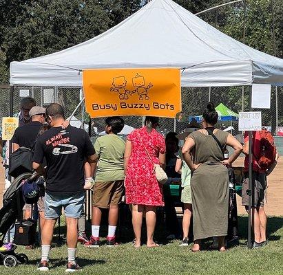 Busy Buzzy Bots inspiring children and parents at Fair Oaks Chicken Festival.