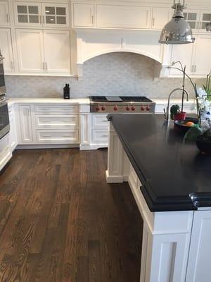 New wide plank flooring installed and finished to a walnut color and finished with Bona traffic Satin