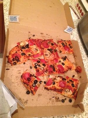 This was just delivered to us.  Absolutely disgusting!! Dominos' response was to offer us a rebate on our next order.  Yea right