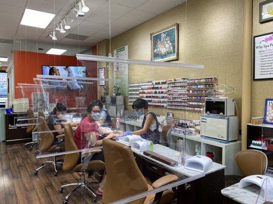 Manicure Station with acrylic/clear shield barriers.