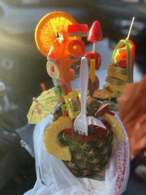 I got a "Pina Loca". You get to pick what fruit you want added to it. Topped with candy and tajin.