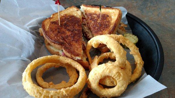 The Vermonter - Grilled Sourdough with real VT roasted turkey, sliced apples, bacon, cheddar cheese, and cranmayo plus homemade onion rings!