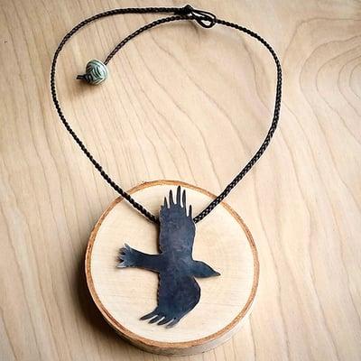 Raven necklace on leather cord with handmade porcelain bead