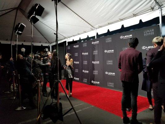 Red carpet outside the studio.