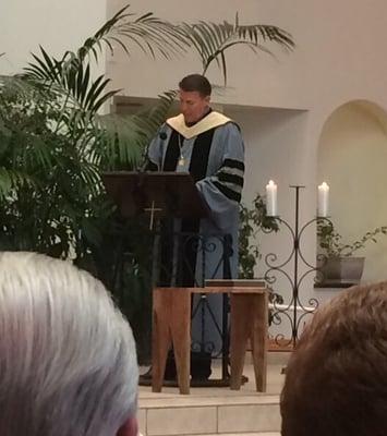 Fur Robert a Schuller giving the ordination blessing to his son Bobby Schuller in 2015