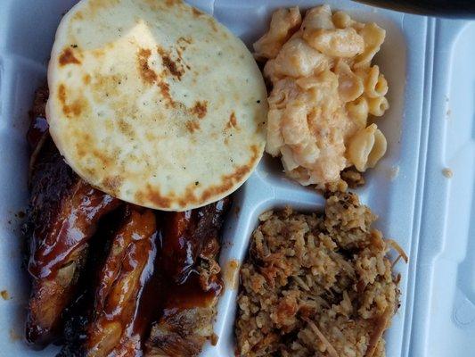 Rib dinner with rice and mac.