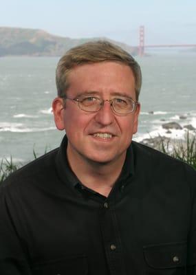 Tim  Grant standing on the overlook to San Francisco Bay.