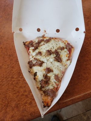 Sausage pizza slices.