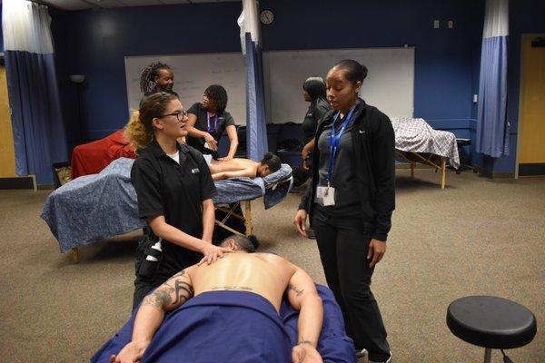 Southeastern Institute Columbia massage therapy students practicing.