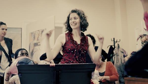 Anaïs with choir kids getting ready for their performance.