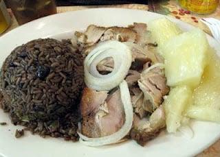 Rice and beans, roast pork, and yuca with mojo sauce