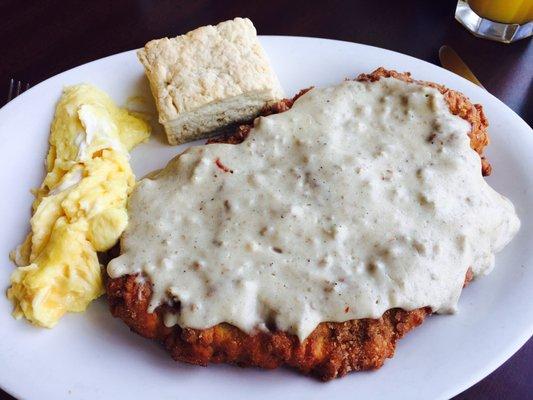 Southern fried steak with sausage gravy, 2 eggs, homemade biscuit. $10.99. Get in my belly!!