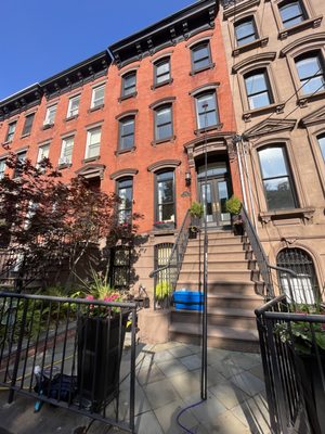 Window cleaning a brownstone