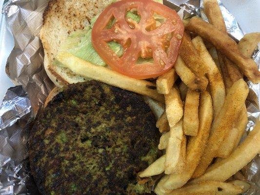 Veggie burger with fries. Served open-faced; easy for adding other condiments.