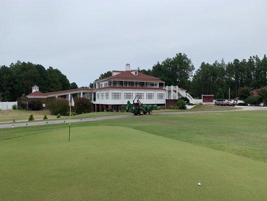 Practice green and clubhouse