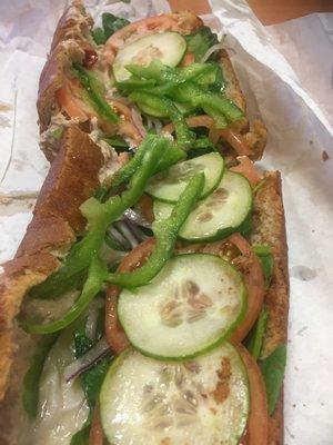 Foot long tuna on wheat topped with provolone cheese, spinach, cucumbers, onions,tomatoes , green peppers, oil, and vinegar