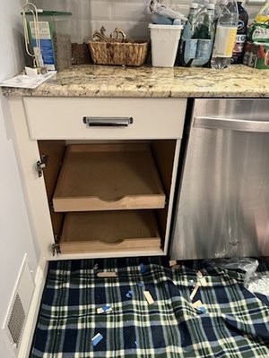 Installed drawers in existing kitchen cabinets for easier storage.