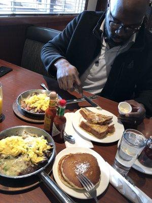 Steak omelette with a side of pancakes