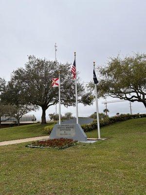 Entrance sign and flags