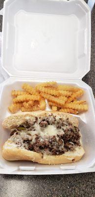 This is a philly cheesesteak with crispy fries. It was very delicious‼