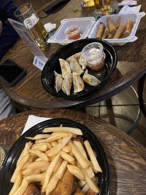 potstickers, french fries and chicken wings, lumpia