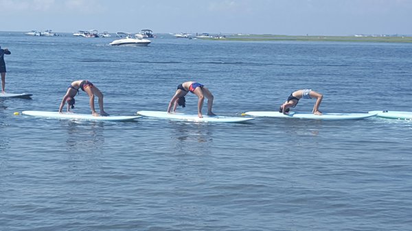 SUP yoga for $40! Also includes a bit of paddle boarding after class