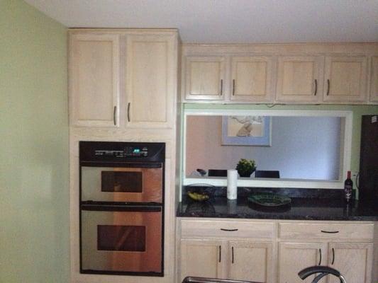 Kitchen pass through. New cabinets, oven, counter tops, floors, carpentry.