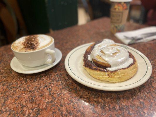 Cinnamon roll and cappuccino