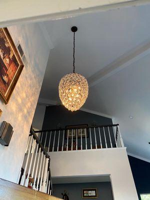 We installed this beautiful chandelier by setting up a scaffolding on the stairs. Customer absolutely loves it!!