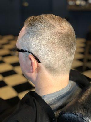 Gentlemen's Haircut. Tapered neckline.