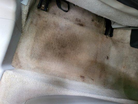 You can see where the floor mat was so therefore you know they didn't pick up the floor mat and cleaned underneath